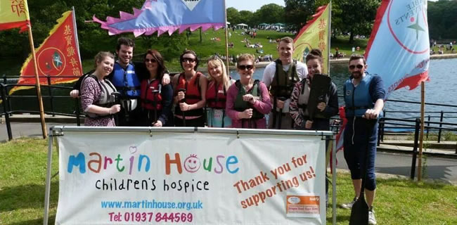 Colleagues running in the Dragon Boat Race at Roundhay Park on Sunday 18th May